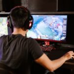 a person sitting behind a PC figuring out strategy games that they like image source: https://www.pexels.com/photo/man-playing-computer-game-7915281/